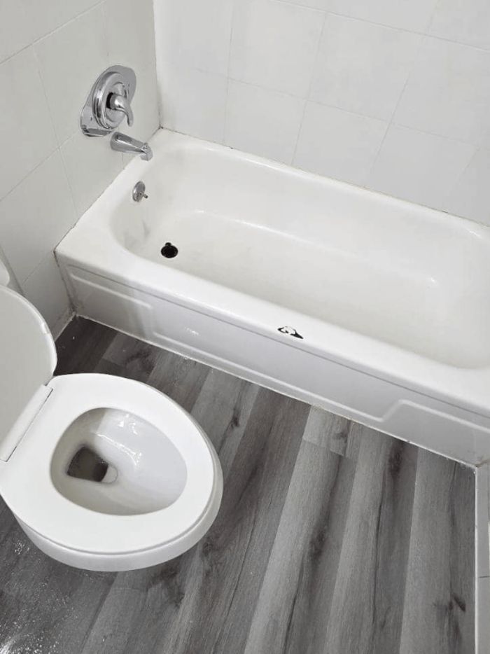 Sparkling clean bathtub and tile after a deep clean by Marce's Magic Eco Cleaning